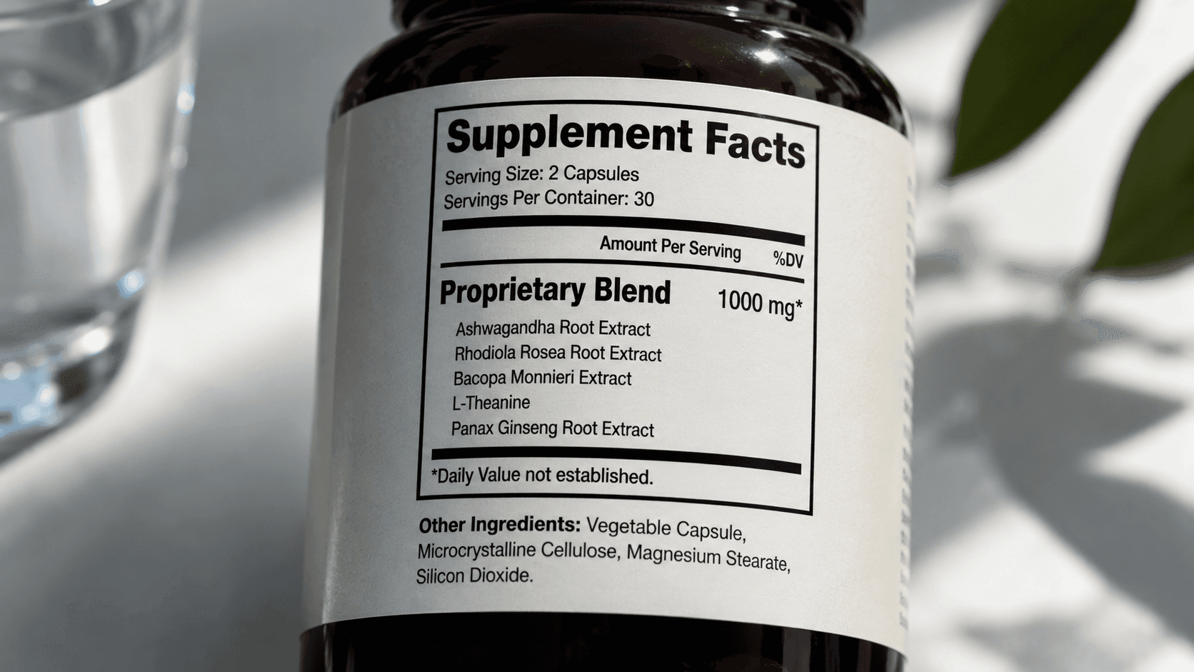 Close-up of a supplement bottle's Supplement Facts label showing a 1000 mg proprietary blend of ashwagandha, rhodiola, bacopa, L-theanine, and panax ginseng with no individual ingredient doses disclosed